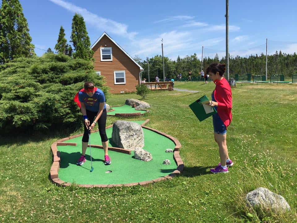 People are playing mini putt in Goodwood Family Golf Ctr